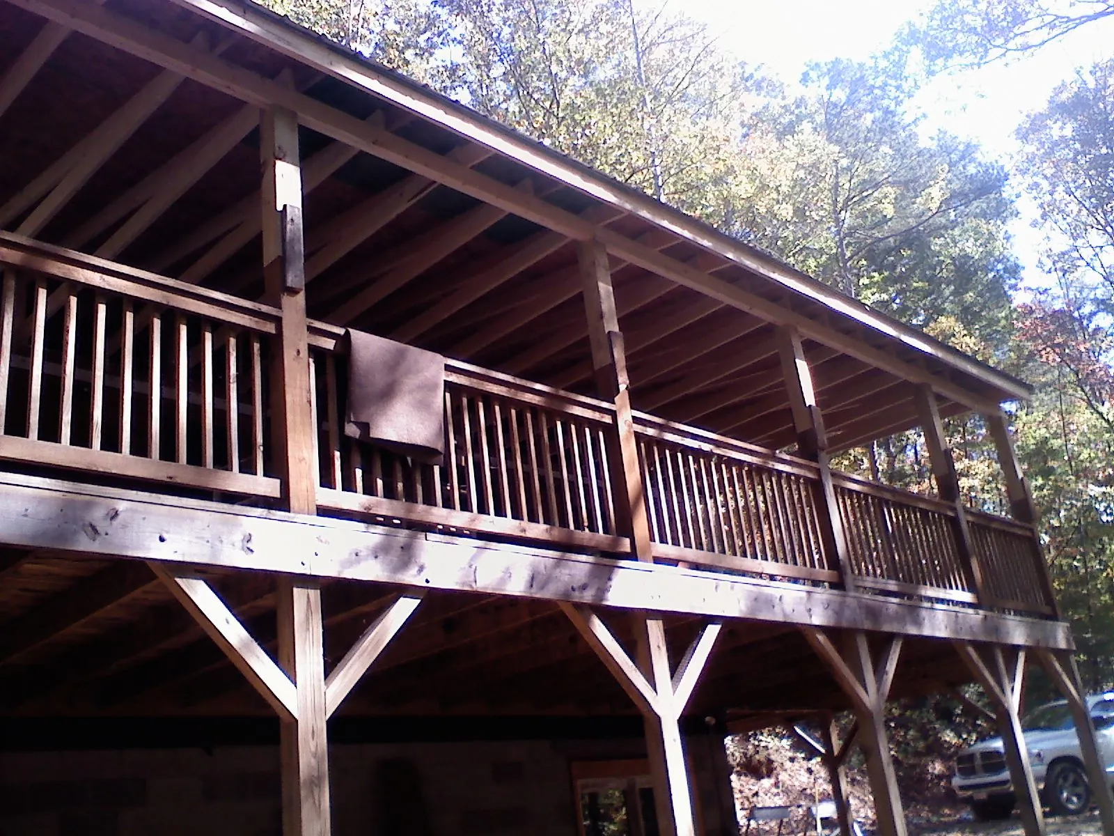 Timber framing under a new elevated porch and deck — Roof Leak Repair in Pfeifer by Roofing Brothers